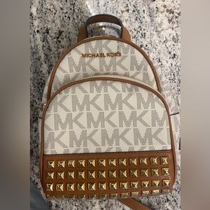 (Brand new) Michael Kors Vanilla/Acrn XS studded backpack for sale.